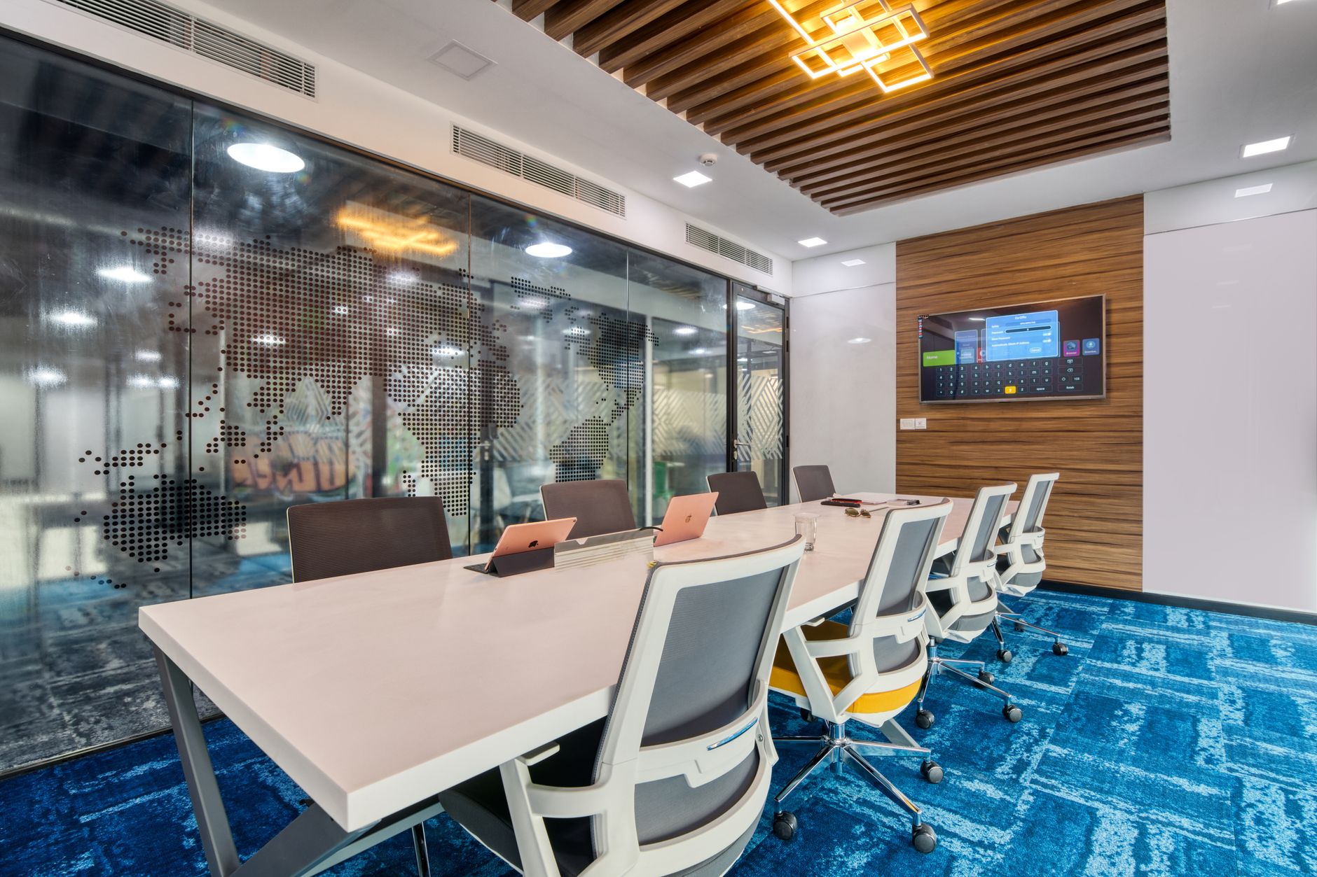 interior of a modern private banking suite with glass-walled offices and digital portfolio dashboards visible on wall-mounted screens
