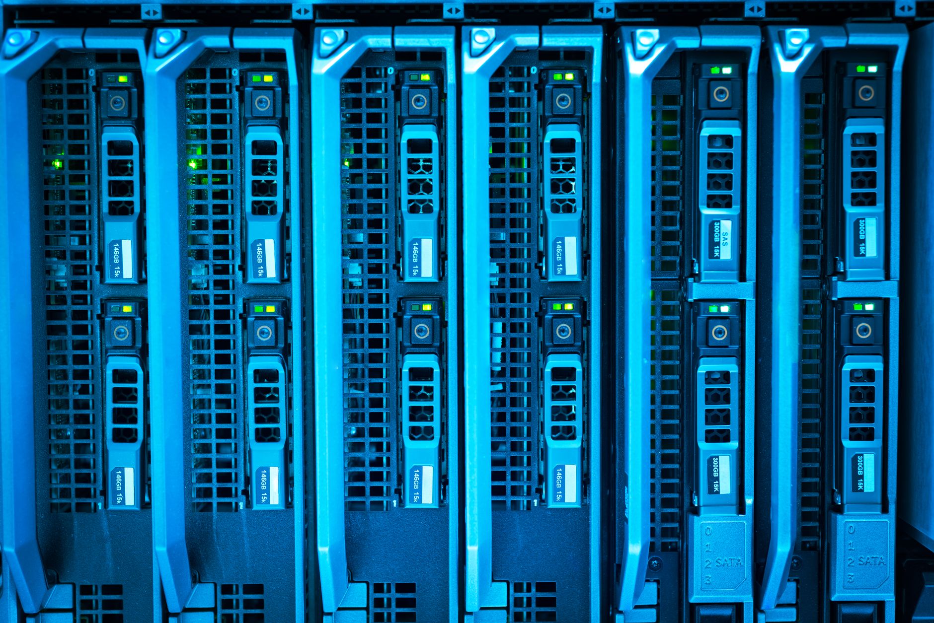 interior of a modern high-performance computing data center, rows of server racks illuminated by blue indicator lights stretching toward a vanishing point