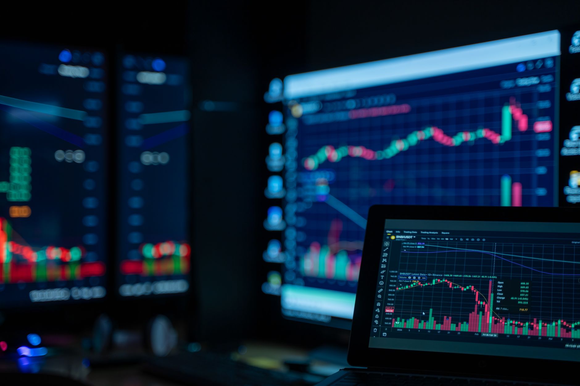 rows of illuminated trading terminals inside a quiet European financial dealing room, screens displaying currency pair charts and yield curves
