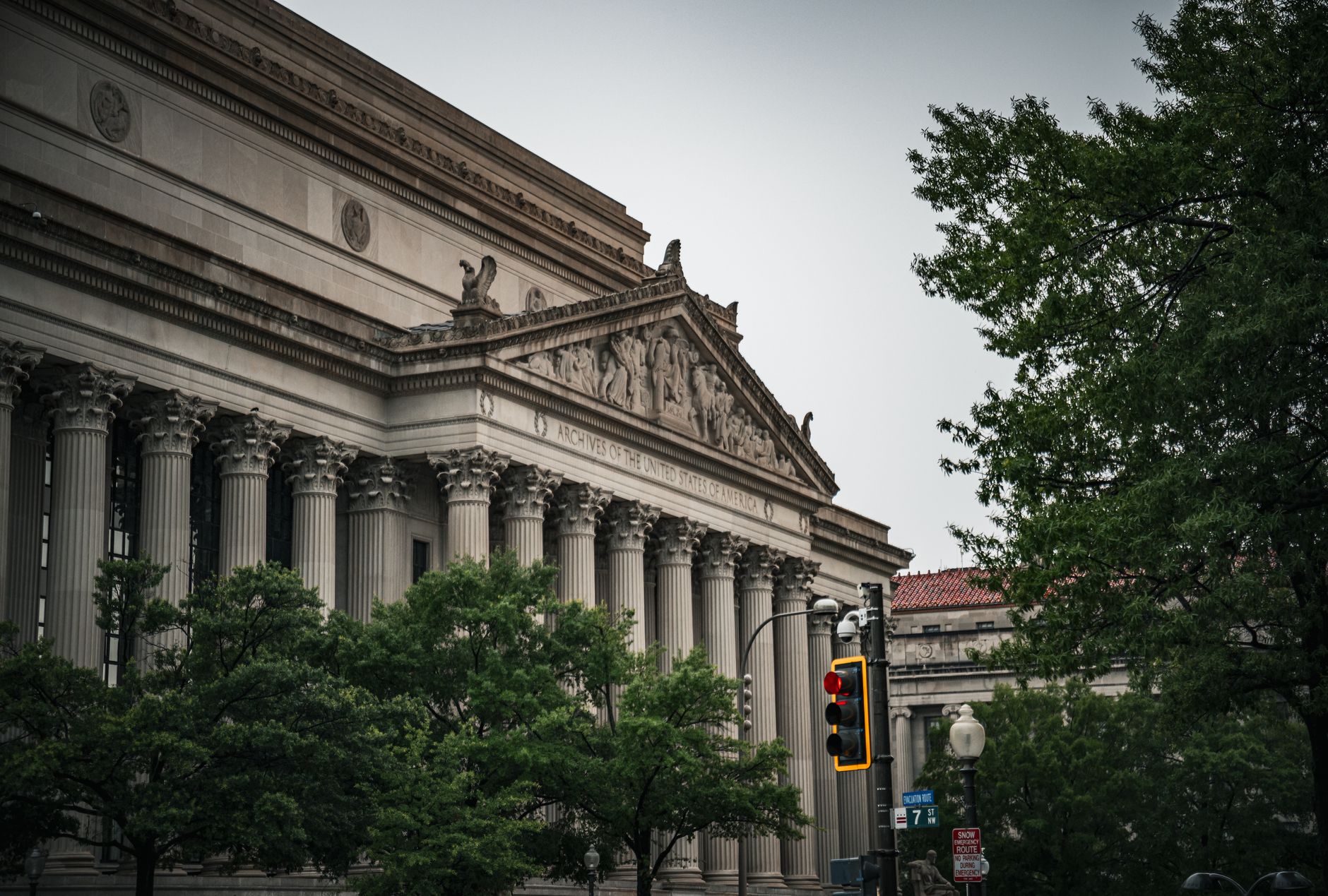 exterior of the U.S. Treasury Department building in Washington D.C. on an overcast morning, its neoclassical stone facade and columns visible from the street