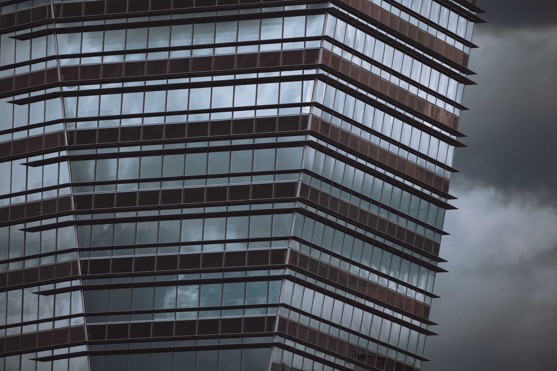 exterior of the People's Bank of China headquarters building in Beijing, with its distinctive modernist facade visible against an overcast sky