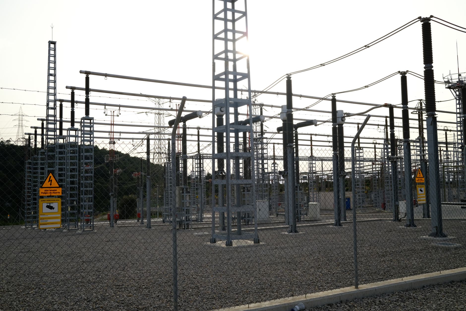 aerial view of Con Edison electrical substations and transmission infrastructure in an urban borough of New York City at dusk