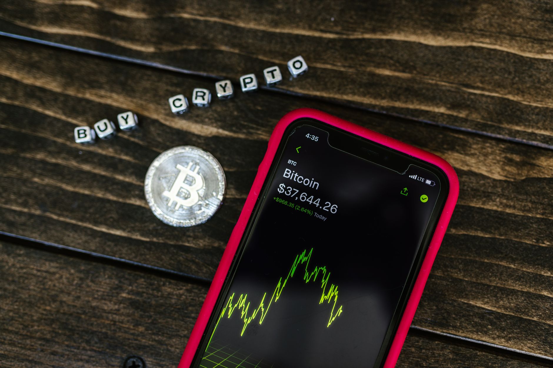 close-up of a smartphone screen displaying a messaging app conversation with a suspicious job offer containing cryptocurrency wallet details