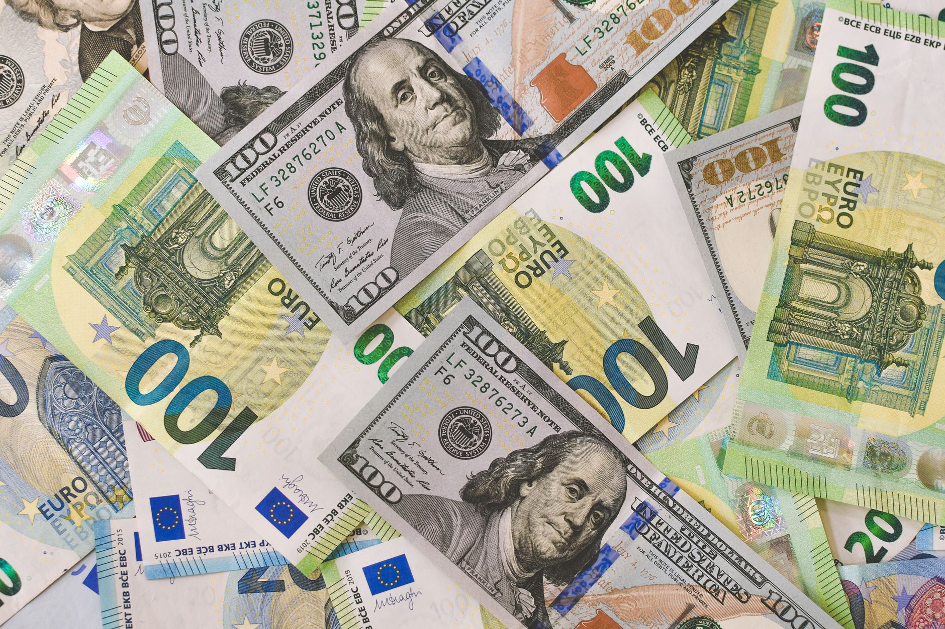 close-up of a currency exchange board inside a Zurich airport terminal displaying USD and CHF rates