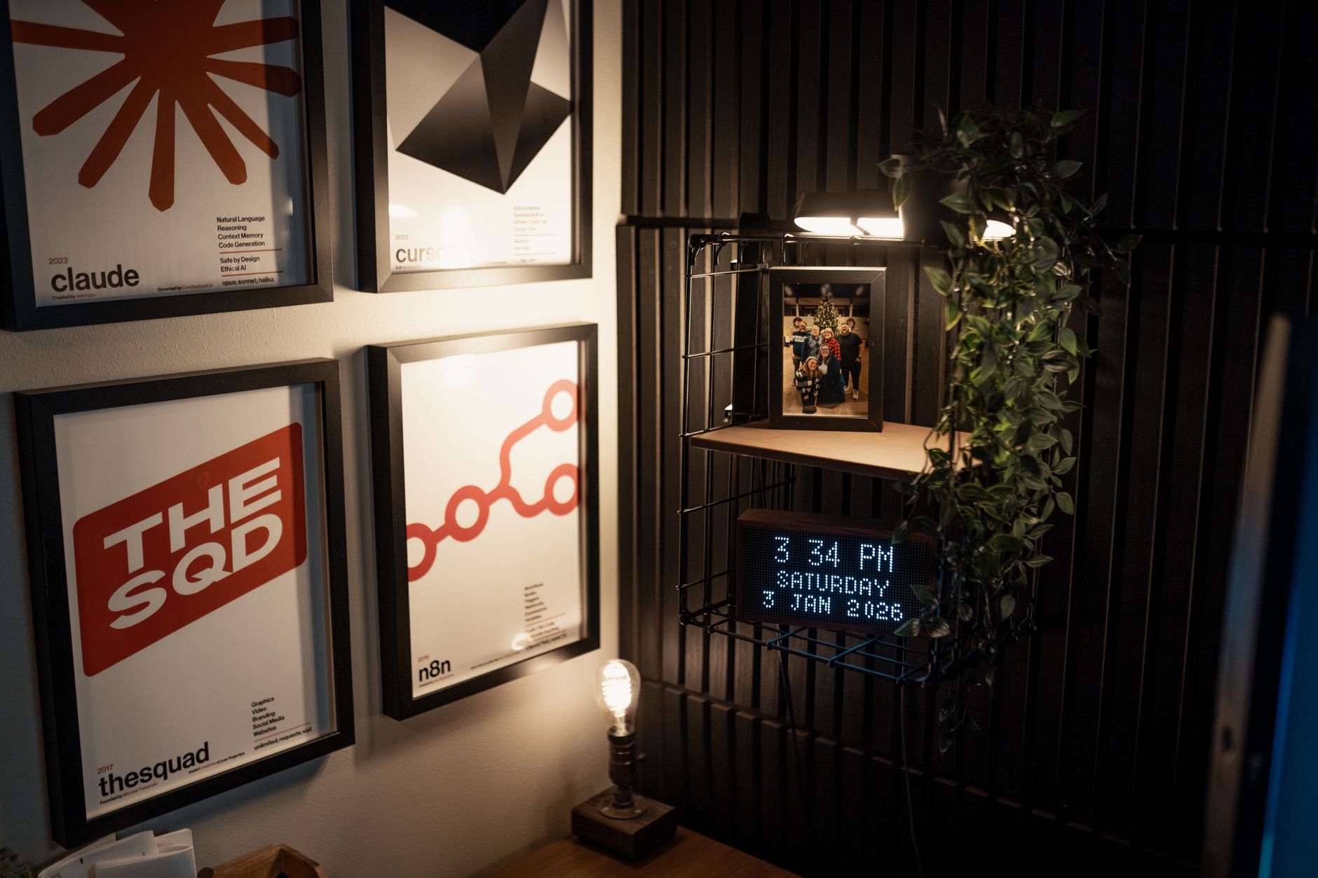 interior of an empty property management office with a desk covered in lease documents, a calculator, and a framed local housing regulation poster on the wall behind