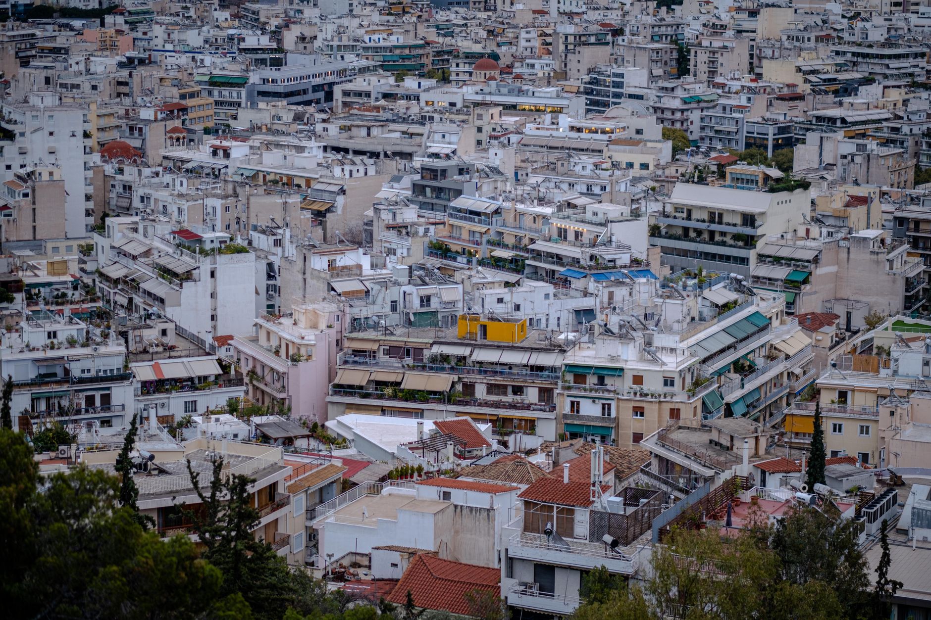 aerial view of Tehran's central bazaar district showing densely packed market stalls and narrow rooftop corridors stretching across city blocks