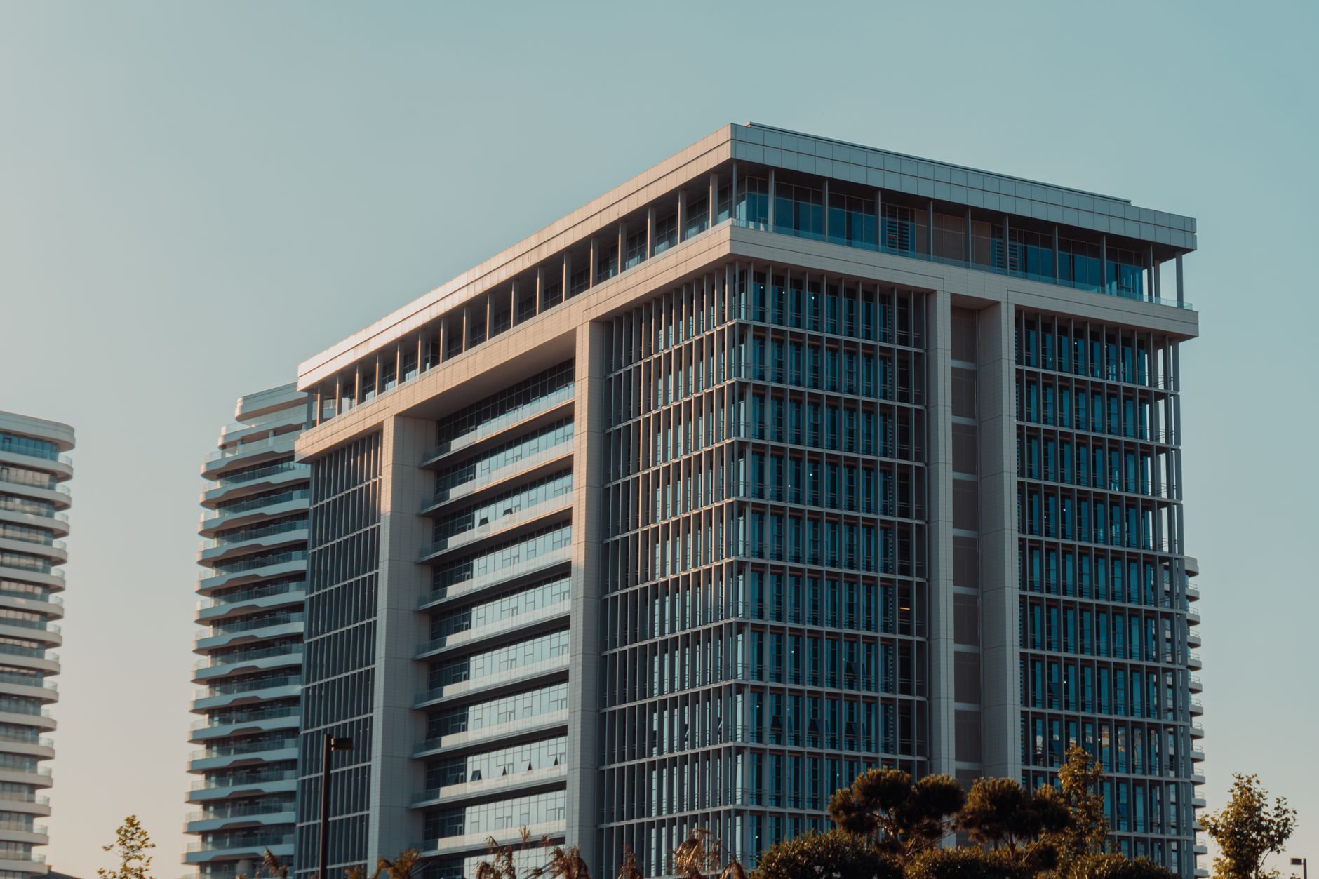 exterior of the Bank of Israel headquarters building in Jerusalem, stone facade visible against a clear sky