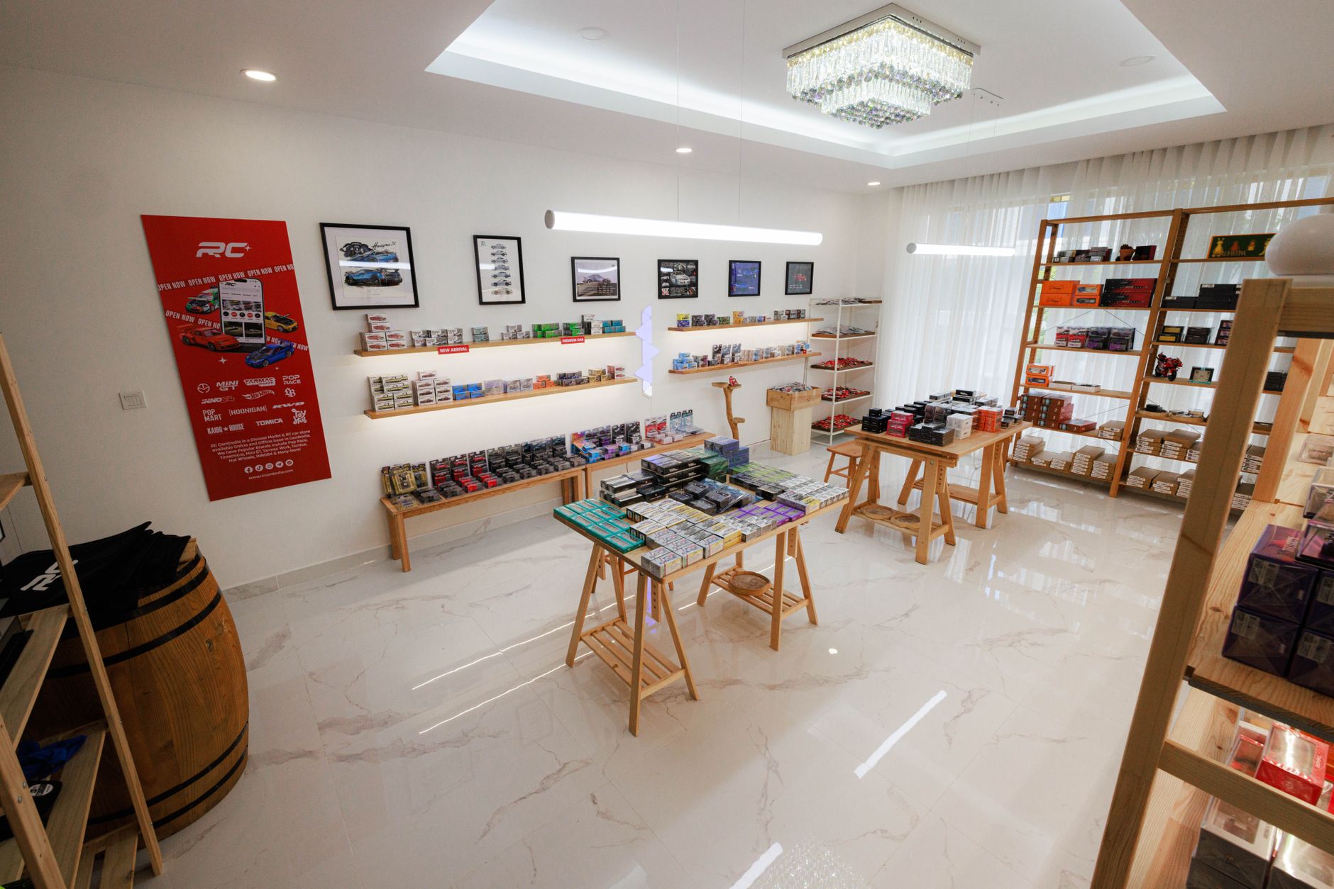 interior of a modern electronics retail showroom in an Asian city, shelves lined with premium smartphones in illuminated display cases