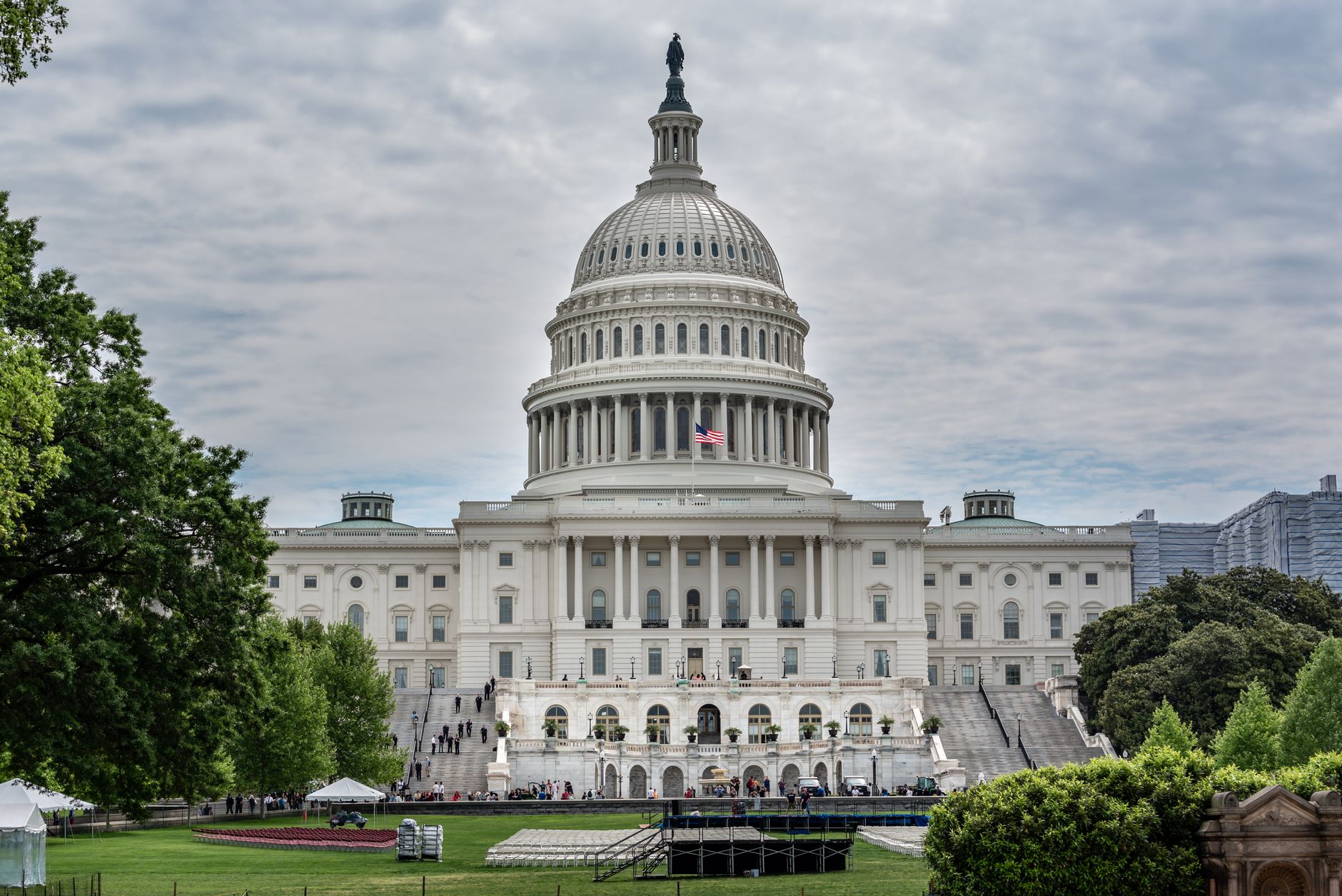 exterior of the US Treasury building in Washington DC at midday, with a wide-angle view of the stone facade and surrounding plaza