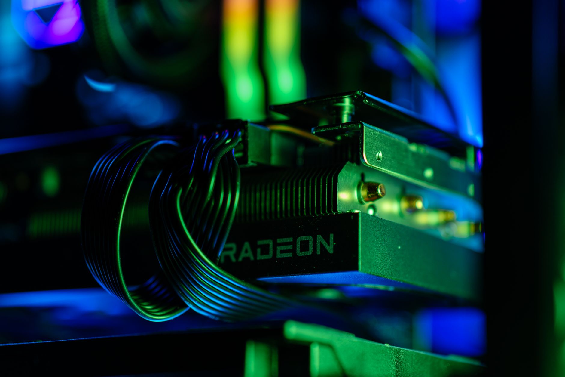 interior of a modern AI research laboratory with rows of high-performance GPU server racks bathed in blue lighting, cables organized along metal frames