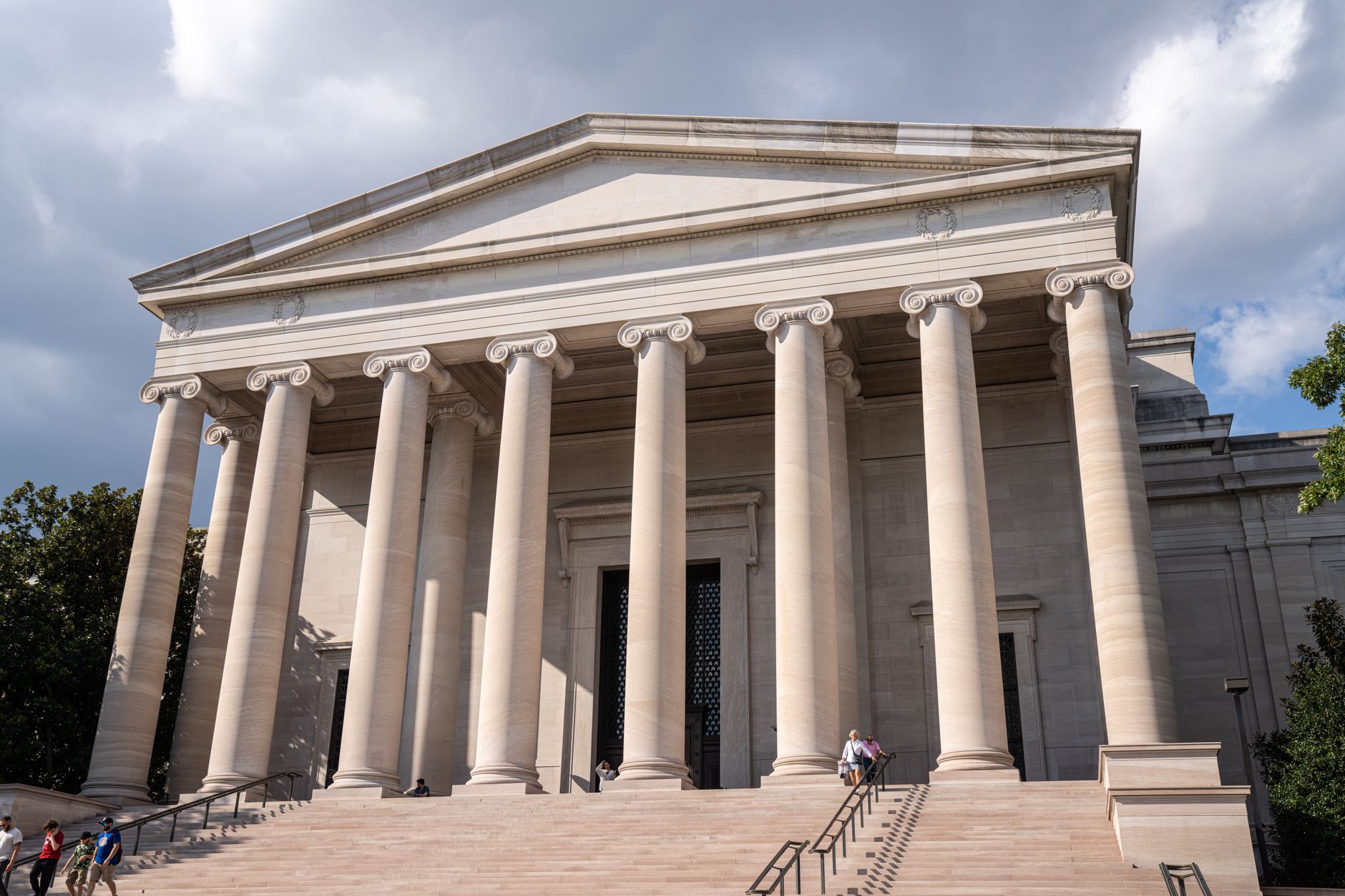 wide-angle shot of the U.S. Treasury building facade in Washington D.C. on an overcast morning, with stone columns and an empty forecourt visible