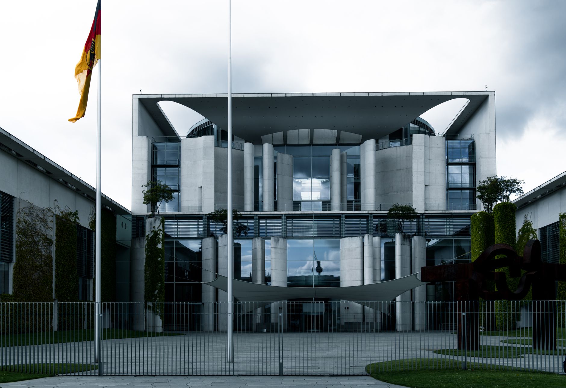 exterior of the Reichstag building in Berlin at early morning, empty plaza, overcast sky