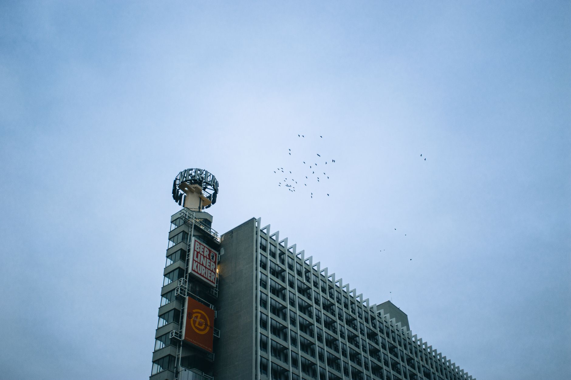 exterior of the Bank of Korea headquarters building in central Seoul, stone facade and signage visible against an overcast sky