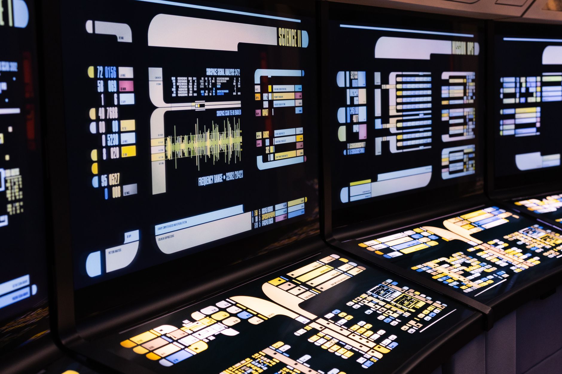 rows of computer terminals inside a Federal Reserve regional bank operations center, monitors displaying financial data with no visible faces