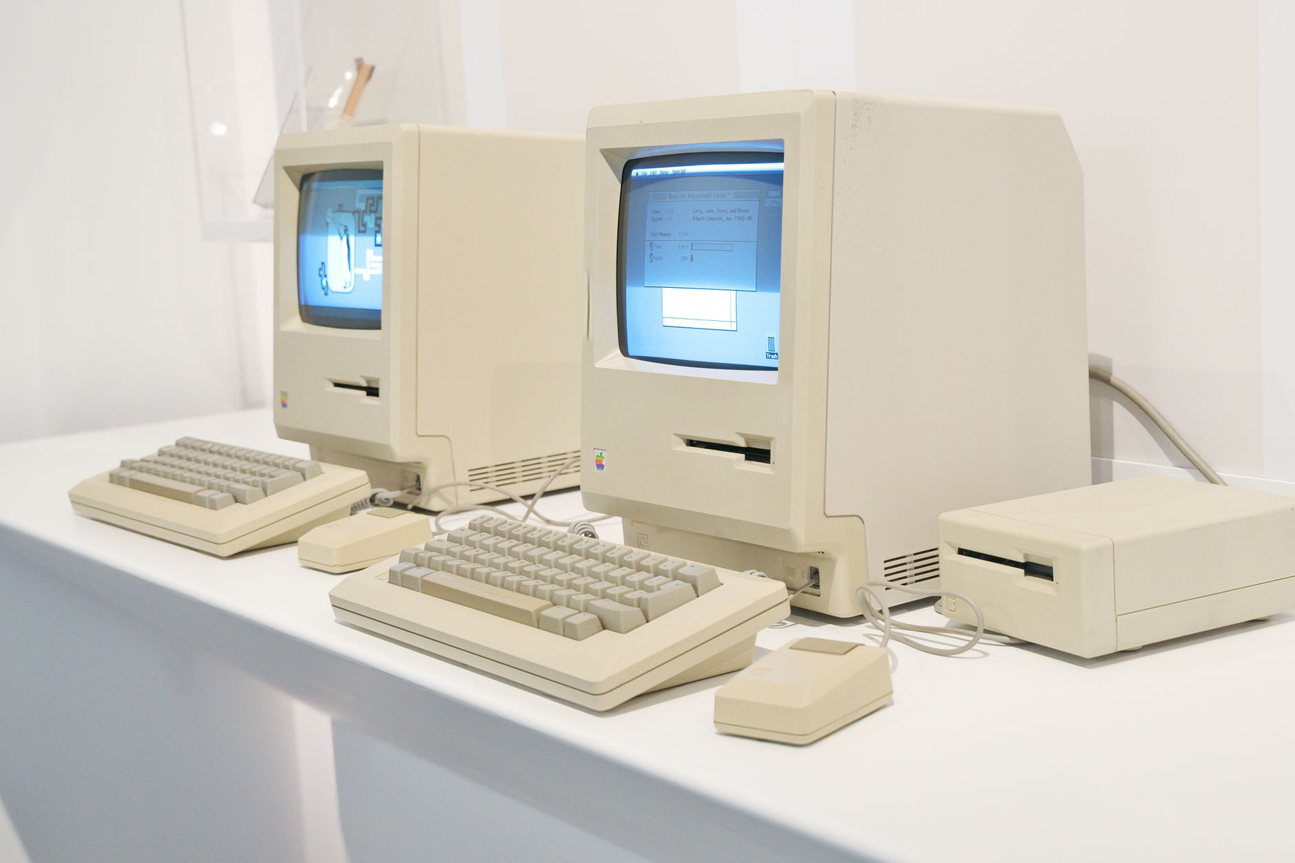 rows of desktop computers in an empty Israeli school computer lab, fluorescent lighting overhead, no students present