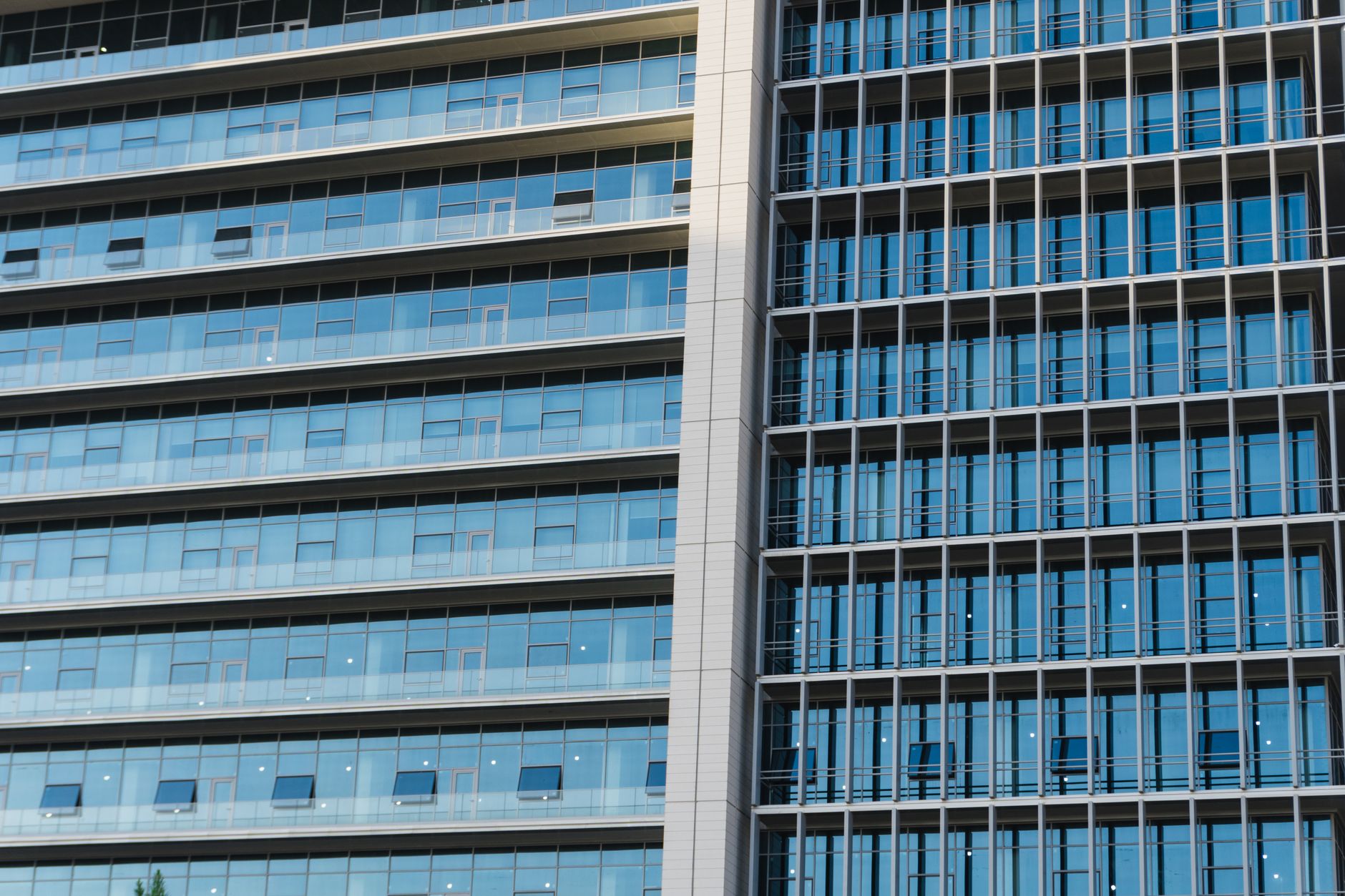 exterior of a modern Tel Aviv technology office building with glass facade, late afternoon light