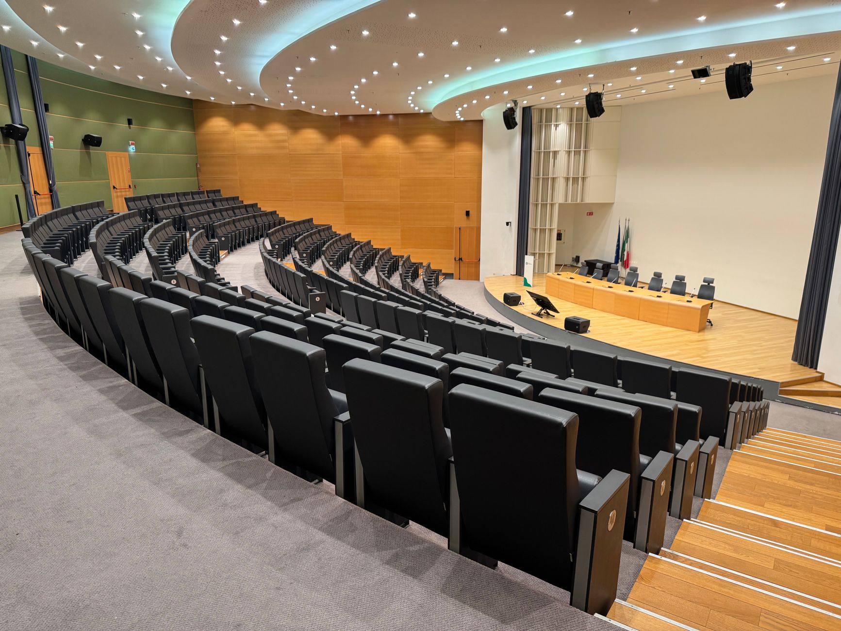 interior of a federal reserve regional branch building showing ornate architecture and rows of empty conference seating