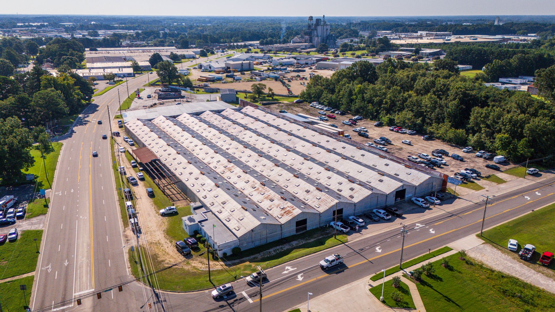 aerial view of an industrial zone in the West Bank with warehouse facilities and access roads visible from above
